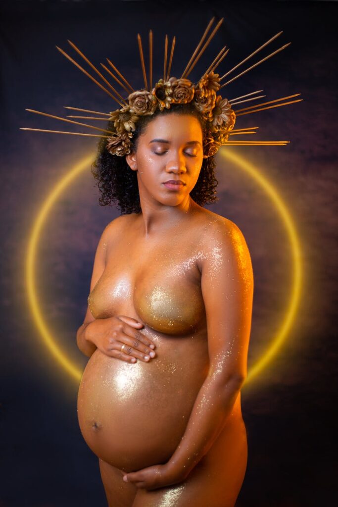 pregnant woman wearing a golden headpiece